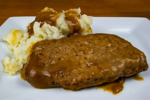 slice of meat loaf with mashed potatoes