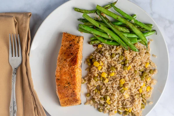 Baked Salmon Served Brown Rice Top Corn Peas Royalty Free Stock Images