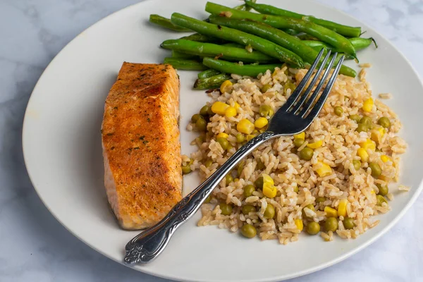 Baked Salmon Served Brown Rice Top Corn Peas Stock Picture