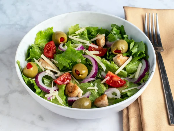 stock image chopped salad with chiclen , onions and olives