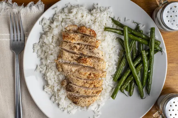 Sliced Season Chicken Breast White Rice Served Sauteed Green Beans Royalty Free Stock Photos