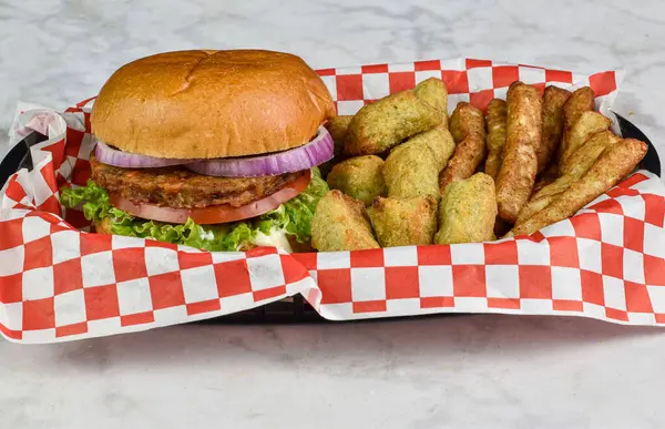 veggie burger served with  veggie  tots and broccoli fries