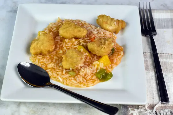 stock image sweet and sour chicken srved with rice