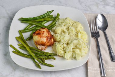  barbecue chicken thigh  asparagus and beans  served with  mashed potatoes top with parsley and pepper,  clipart