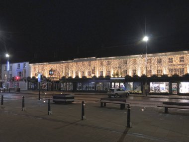 High Street, Northallerton, North Yorkshire, England, United Kingdon - December 18, 2023: Christmas lights on Barkers of Northallerton shopping center at night clipart