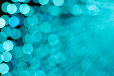 Mavi Bokeh 'in soyut mavi arka planı bulanık ışık çemberleri.