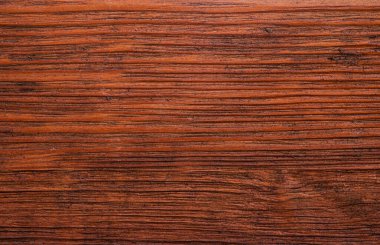 Dark brown natural textured wooden background.