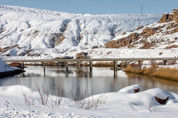 stock image Erzincan Province, li District with snowy landscapes, river and historical bridge