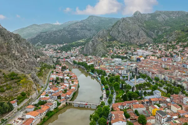 stock image Fascinating view of the city of Amasya, also known as the city of princes. wonderful clouds coming out of the mountains. YESILIRMAK river.