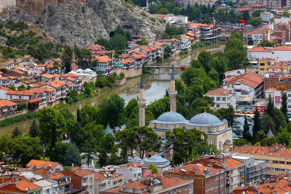 stock image Fascinating view of the city of Amasya, also known as the city of princes. wonderful clouds coming out of the mountains. YESILIRMAK river.