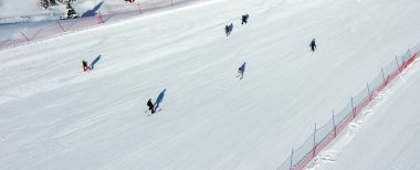 A view of skiers from Ergan ski resort, located among the mountains in Erzincan Province. clipart