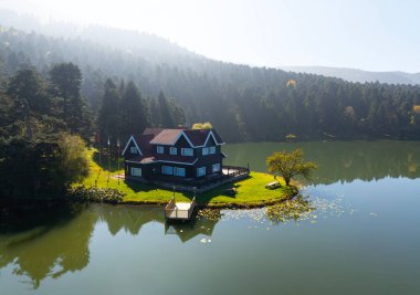 Bolu Golcuk Lake and famous house view with reflections. clipart