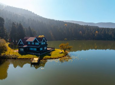 Bolu Golcuk Lake and famous house view with reflections. clipart