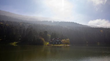 Bolu Golcuk Lake and famous house view with reflections. clipart