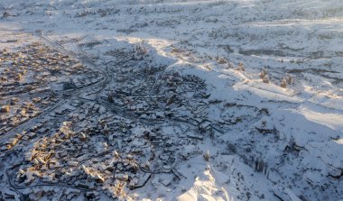 Drone view of the snowy city center of Cappadocia in winter clipart