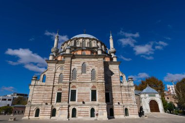 Laleli Mosque also known a Tulip mosque. Exterior shot. Arabic text as decor (verses from Koran, muslim Holy book). Ottoman clipart