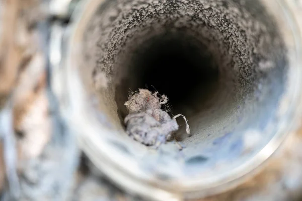 stock image Typical home mainenance task of cleaning out plugged and dirty vent lines