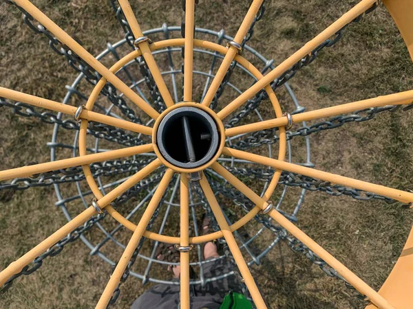 Different perspective view of a disc golf basket