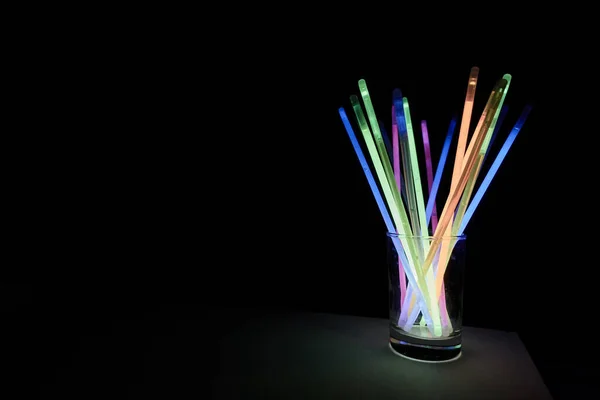 arrangement of multi-colored glow sticks . High quality photo