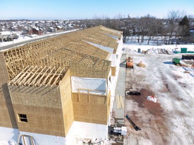 Aerial drone view of a multifamily apartment complex under construction. High quality photo