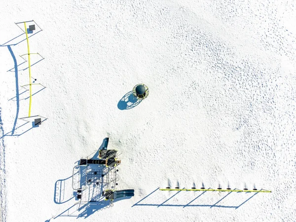 stock image Aerial overhead drone view of school playground equipment covered in snow. High quality photo