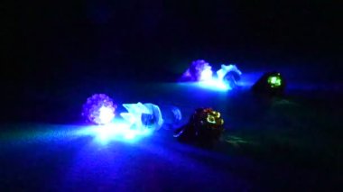 Multi-colored red, green, and blue glowing party flashing rings. High quality FullHD footage