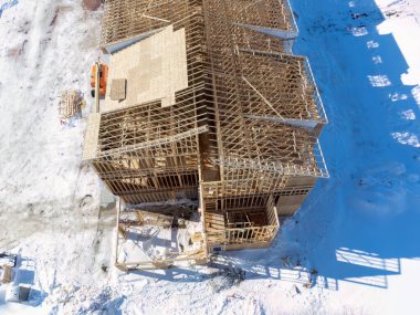 Aerial drone view of a multifamily apartment complex under construction. High quality photo