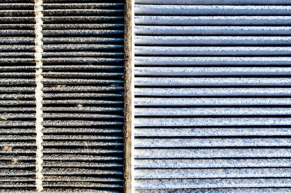 Side-by-side comparison of a dirty and clean automotive cabin filter. High quality photo