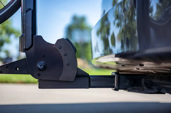Rear mounted bike rack connected to a vehicle trailer hitch receiver. . High quality photo