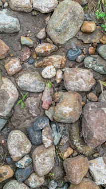 In situ Native American arrowhead artifact found in sand bed of a river . High quality photo
