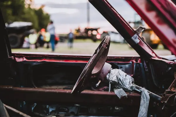 stock image Selective focus on the interior steering column and wheel on a modified car for a demolition derby. High quality photo