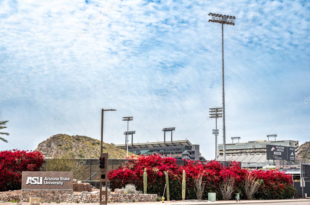 Phoenix, Arizona, USA - 3.23.2024: Focus on Sundevil logo with distant view of Arizona State University Mountain America Stadium. High quality photo