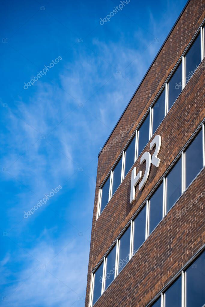 Sioux Falls, South Dakota, USA - 5.15.2025: Selective focus on the engineering firm HDR logo. High quality photo