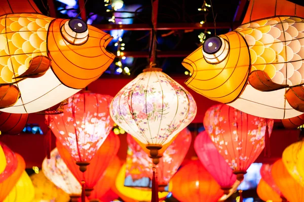 Multicolored Chinese lanterns illuminated at night low angle view for the Chinese new year