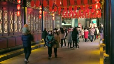 Chengdu, Sichuan province, China - Jan 20, 2023 : People walking in Jinli ancient street at night during the Chinese new year holidays