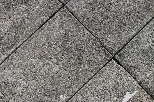 Weathered pavement tiles with copy space and gray stone concrete Texture. Texture and Pattern for industrial background.