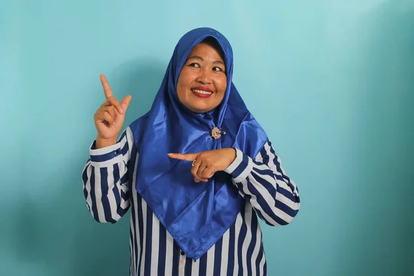 Enthusiastic Middle Aged Asian Woman Blue Hijab Striped Shirt Points — Stock Photo, Image