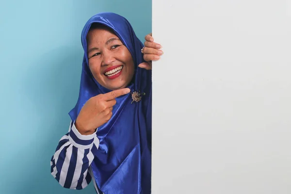 Excited Middle Aged Asian Woman Blue Hijab Striped Shirt Holds — Stock Photo, Image
