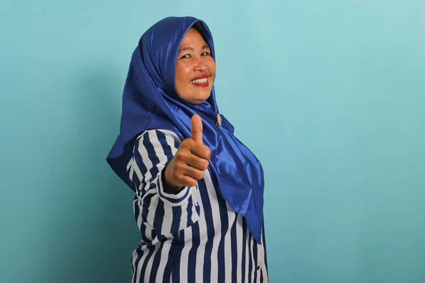 Excited Middle Aged Asian Woman Blue Hijab Striped Shirt Shows — Stock Photo, Image