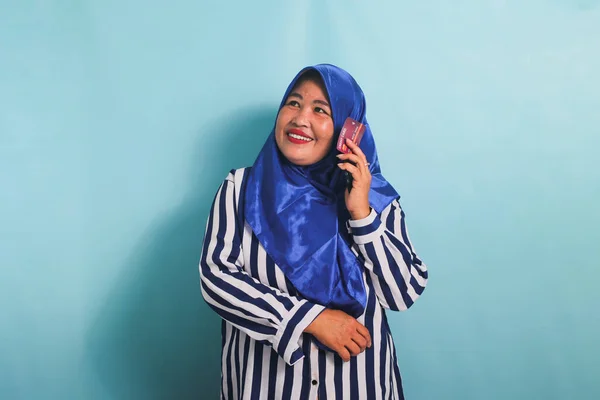 Smiling Middle Aged Asian Woman Blue Hijab Striped Shirt Holding — Stock Photo, Image