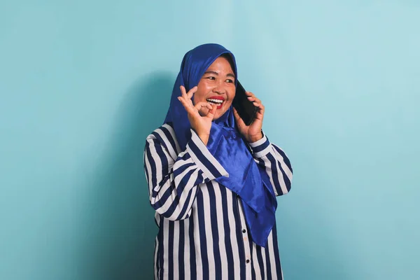 Excited Middle Aged Asian Woman Blue Hijab Striped Shirt Making — Stock Photo, Image