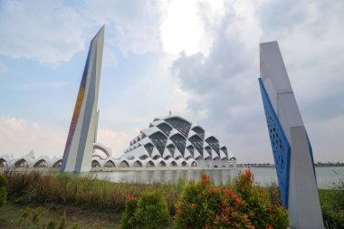 Bandung, West Java, Indonesia - October 04, 2024: Landscape view of The Al Jabbar Mosque, also known as the Al Jabbar Grand Mosque or the Floating Mosque of Gedebage, located in Bandung, West Java clipart