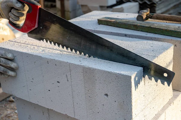 Preparation of aerated concrete block. Sawing a gas block. Construction of aerated concrete bricks. High quality photo