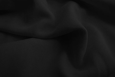 Soyut siyah dalgalı kumaş. Koyu renk kumaş arkaplan.