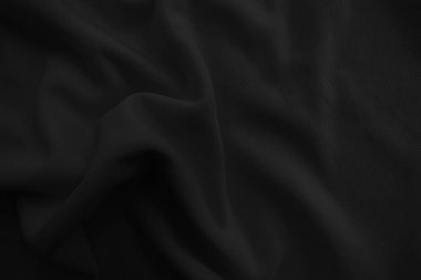 Soyut siyah dalgalı kumaş. Koyu renk kumaş arkaplan.