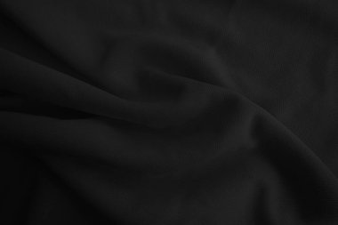 Soyut siyah dalgalı kumaş. Koyu renk kumaş arkaplan.