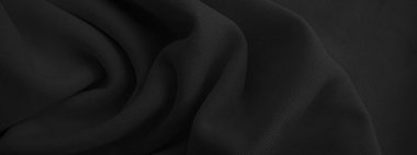 Soyut siyah dalgalı kumaş. Koyu renk kumaş arkaplan.
