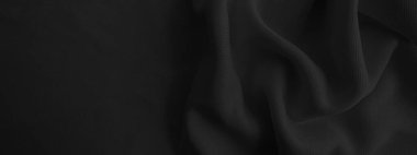 Soyut siyah dalgalı kumaş. Koyu renk kumaş arkaplan.