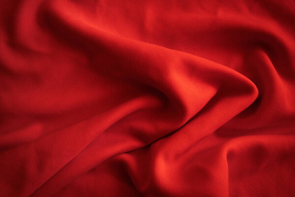 Abstract Red wavy cloth. Red fabric background.