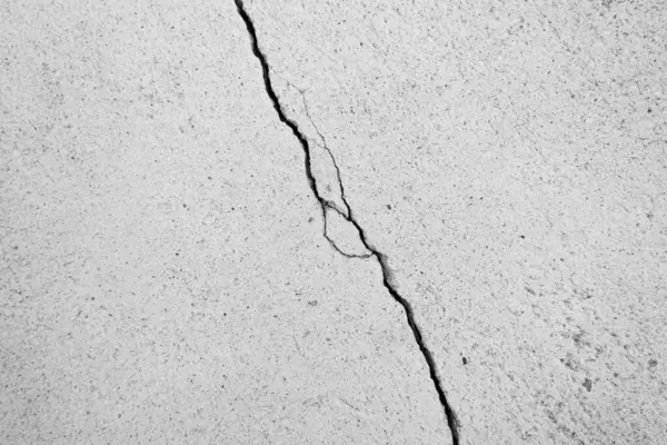 Cracked wall. Concrete crack background.